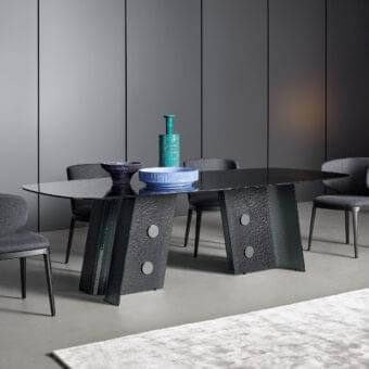 Elegant Bonaldo Botón table with smoked tempered cast glass top and lead plus metal base inserts in glossy hue
