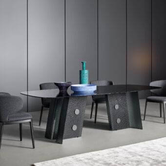 Superior Bonaldo Botón table with organically shaped smoked tempered cast glass top and textured lead plus metal base