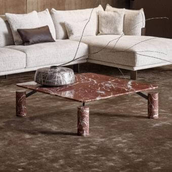 Exceptional Bonaldo Magic coffee table with red and white marbled top and cylindrical legs crafted with dark metal brackets