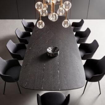 Elegant Bonaldo Mellow 400 table with brushed Coal oak and chevron veneered wood top resting on a unique central base