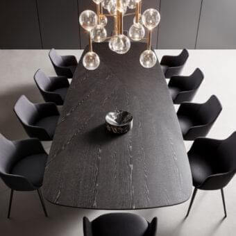 Exceptional Bonaldo Mellow 400 table crafted in Canaletto Walnut veneered wood with a chevron grain and sculptural base
