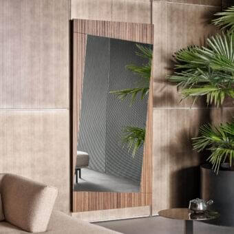 Distinguished Bonaldo Musa mirror with angled top in ribbed Canaletto Walnut wood showcasing reflective glass