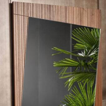 Exceptional Bonaldo Musa mirror with rectangular reflecting surface and rhythmic ribbed Canaletto Walnut wood framing