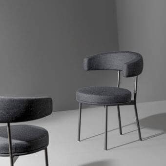 Distinctive Bonaldo Neuilly armchair with dark gray textile upholstery and matte metal frame