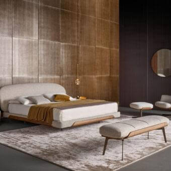 Exceptional Bonaldo Olos bed crafted in light beige textile upholstery with curved Canaletto Walnut wood and matt varnished metal feet