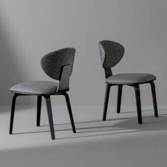 Harmonious Bonaldo Olos chair with curved silhouette upholstered in matte medium gray textile and coal ash wood legs