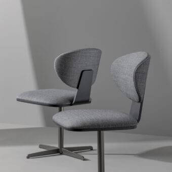 Elegant Bonaldo Olos chair with textured gray fabric upholstery and coal ash wooden lower backrest in dark gray metal finish