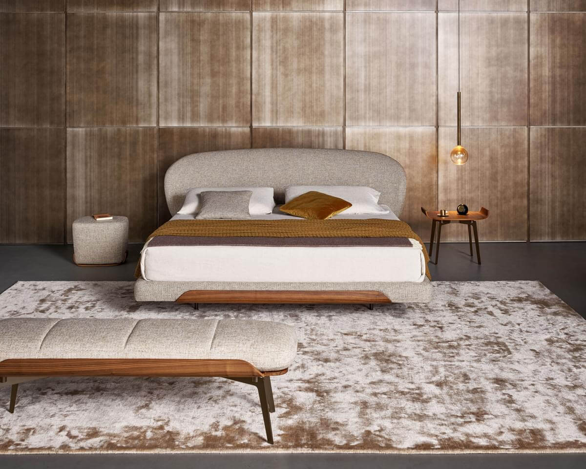 Distinguished Bonaldo Olos nightstand with a curved wood top and slender metal legs in a smooth medium-toned brown finish