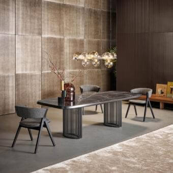 Elegant Bonaldo Remo chair with a curved back crafted in medium gray fabric and dark coal finished solid ash wood legs