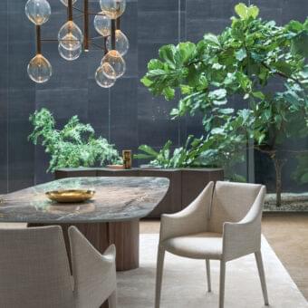 Elegant Bonaldo Vela armchair with steel structure, high-density rubber padding and refined beige fabric upholstery
