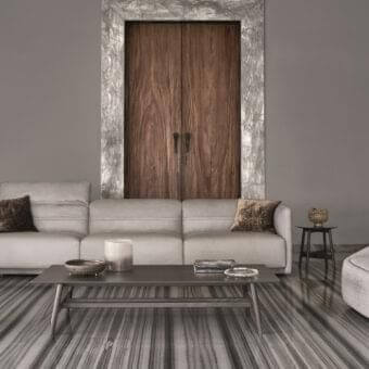 Refined Ditre Italia Arlott sofa with light grey matte textile upholstery and brown velvet-like pillows