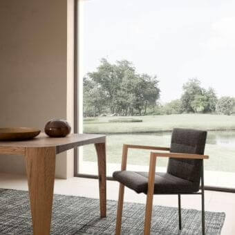 Sophisticated Presotto Vega armchair with dark gray ribbed textile and light natural wood with dark metal legs