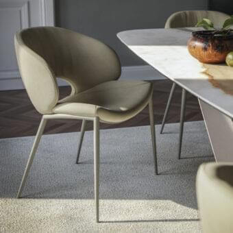 Distinguished Cattelan Italia Miranda ML chair upholstered in smooth beige textile-like material with slender steel legs