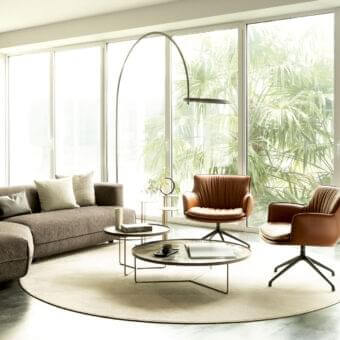 Exceptional Cattelan Italia Rhonda lounge chair with warm brown textile upholstery and black metal swivel base