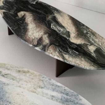Superior Rugiano Rock coffee table with an elongated oval marble top and bronzed brass metal legs