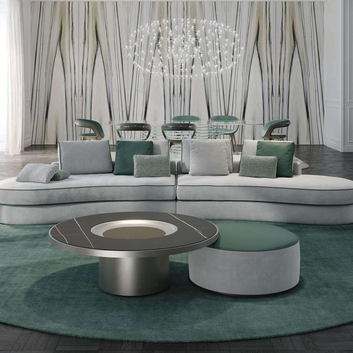 Curved gray seating with green cushions surrounds dual circular forms on a green rug before a dining table and textured wall panels