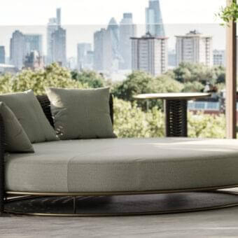 Exclusive Rugiano Marina daybed with bronze metal base and dark brown hand-braided rope, accented with muted green cushions
