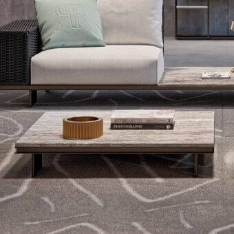 Elegant Rugiano Memphis coffee table with outdoor bronze aluminum base and light gray beige stone-like material top