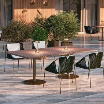 Superior Rugiano Wood table with parallel medium brown slats and outdoor bronze metal support column