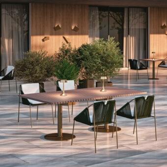 Superior Rugiano Wood table with a refined rectangular wooden top and outdoor bronze metal base
