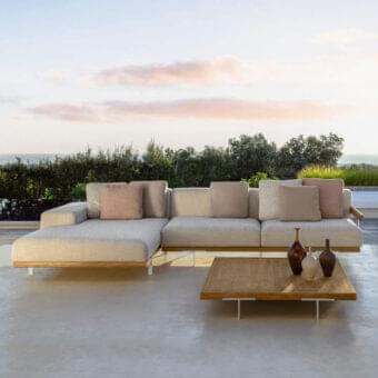 Distinguished Talenti Allure sectional with light beige cushions and sleek aluminium feet built upon a solid wooden frame