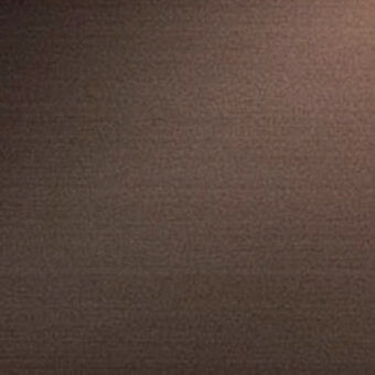 Bronze metal texture with mottled, irregular pattern and warm tones, exhibiting a brushed finish and matte surface with diffused lighting.