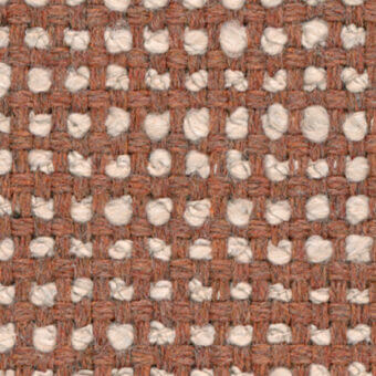 Woven rug, brown and off-white, grid pattern with looped circular motifs, textured jute weave, neutral studio backdrop.