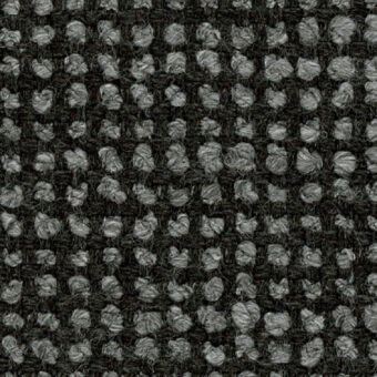 Woven fabric texture with repeating light gray circular elements on a dark gray background, displaying a dense, speckled, grid-like pattern.