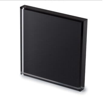 Acrylic plaque with black panel, beveled edges, and glossy finish displayed against a white backdrop for material showcase.
