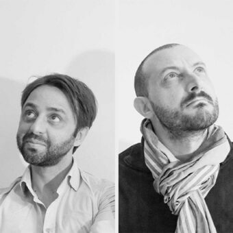 Diptych portrait of two men looking up, neutral backgrounds, light-colored clothing, dark hair and beard, studio lighting, text “bellavista piccini”.
