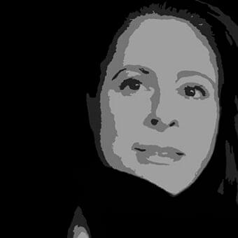 Grayscale portrait of a face with posterized tones looking upwards and right against a dark background