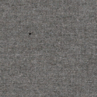 Woven texture in gray-antracite displays granular density, featuring a central circular void; even lighting highlights surface detail.