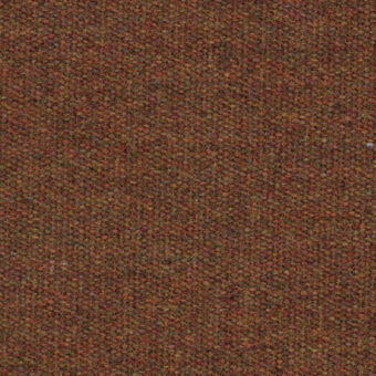 Pergamena C394 Ruggine rug, reddish-brown textured surface, granular weave with orange and yellow tone variations, studio lighting.