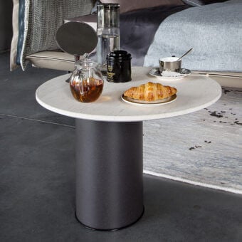 Elegant Arketipo Petra side table with a round sandstone tabletop and micaceous brown cylindrical base