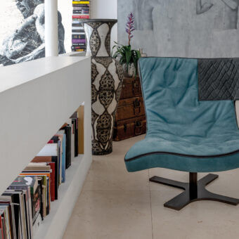 Superior Arketipo Roxy lounge chair in striking blue quilted textile with black piping and dark wood base
