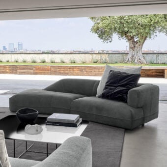 Distinguished Arketipo Starman sofa crafted in Italy with curved silhouette and dark gray textile upholstery