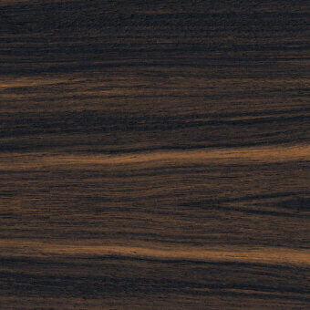 Ebano macassar wood texture displaying dark brown tones, long flowing grain, and a polished finish with subtle tonal variations.