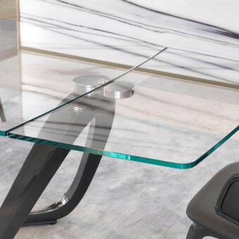 Exceptional Reflex Segno table with extra-clear glass top and looping dark gray glossy base crafted for contemporary dining spaces