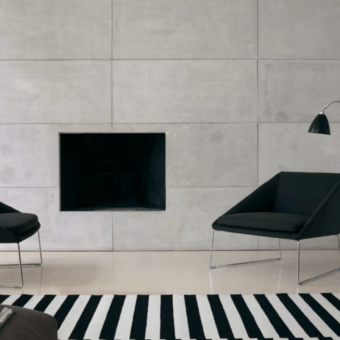 Exclusive Verzelloni Kelly lounge chair with dark textile upholstery and chrome finished metal sled base