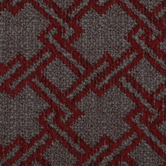 Diamond textile pattern in deep red and gray tones, featuring a dense, raised weave and diagonally oriented geometric motifs.
