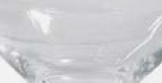 Murano glass vase, clear with rounded shape and undulating surface, featuring a flared base and subtle light refractions.