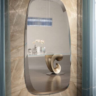 Elegant Reflex Seventy mirror crafted in Marmoreflex with polished edges and organically shaped extra-clear glass presenting neutral tones with darker veins
