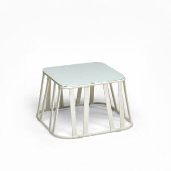 Distinguished Roberti Rattan Hamptons Graphics coffee table with powder-coated aluminum base and lacquered pale blue-green glass top
