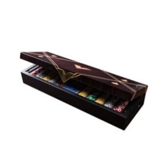 Dark brown presentation box with gold geometric foil design, containing twelve individually wrapped, multicolored chocolates arranged inside.