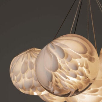 Distinguished Bocci 118 Cluster suspension lamp with thirteen hand-blown glass pendants and swirling frosted finish in warm off-white hues