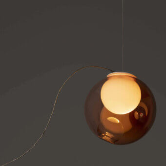 Elegant Bocci 28 single sculptural lamp with clear glass exterior and milk white interior cavity