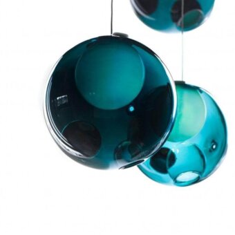 Elegant Bocci 28 suspension lamp crafted in glossy teal glass with a milk white interior and refined spherical form