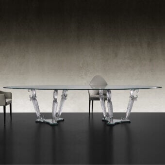 Distinguished Reflex Casanova table with transparent Murano glass legs and black lacquered glass plinth crafted from extra-clear beveled glass