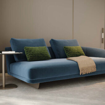 Distinguished Reflex Segno sofa upholstered in smooth matte muted blue textile with metal legs and goose feather back cushions