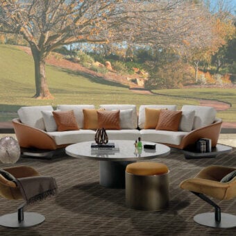 Refined Reflex Segno sofa with light beige fabric cushions and tan leather-like frame built upon a Canaletto Walnut platform